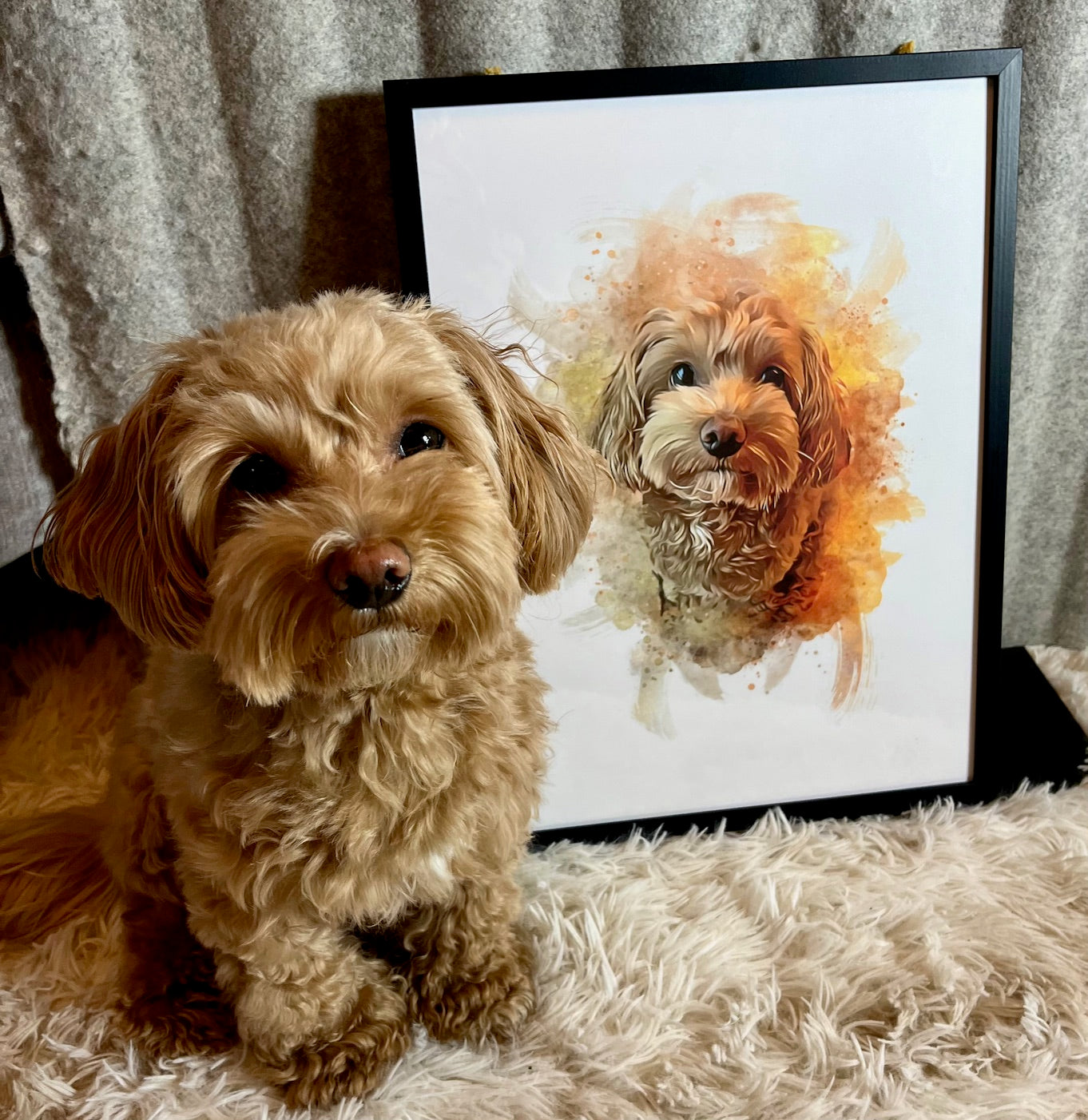 Dog sitting next to a framed watercolor portrait of itself on a textured surface.